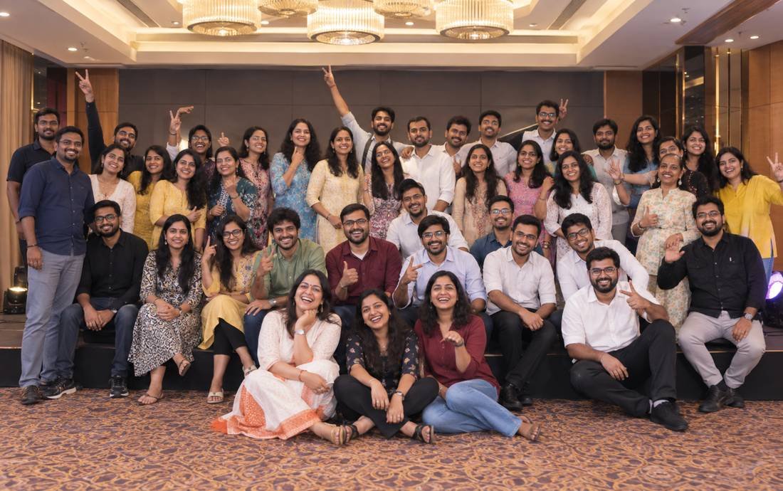 A large team celebrating together