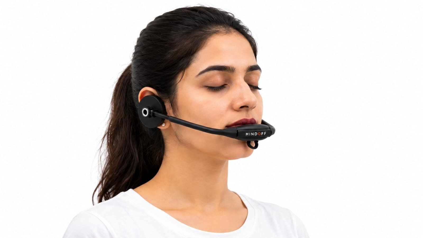A woman wearing the MindOFF™ device, shown from a three-quarter angle