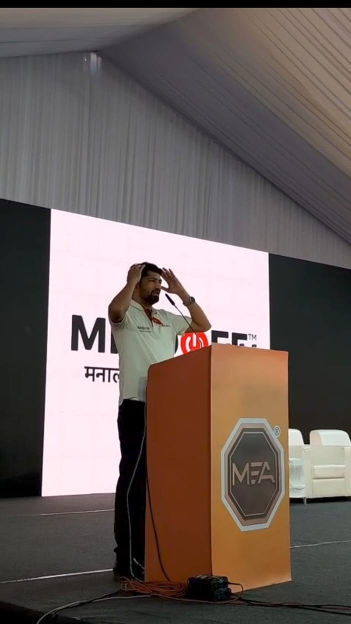 Mr. Vijay Thakre speaking at a podium event